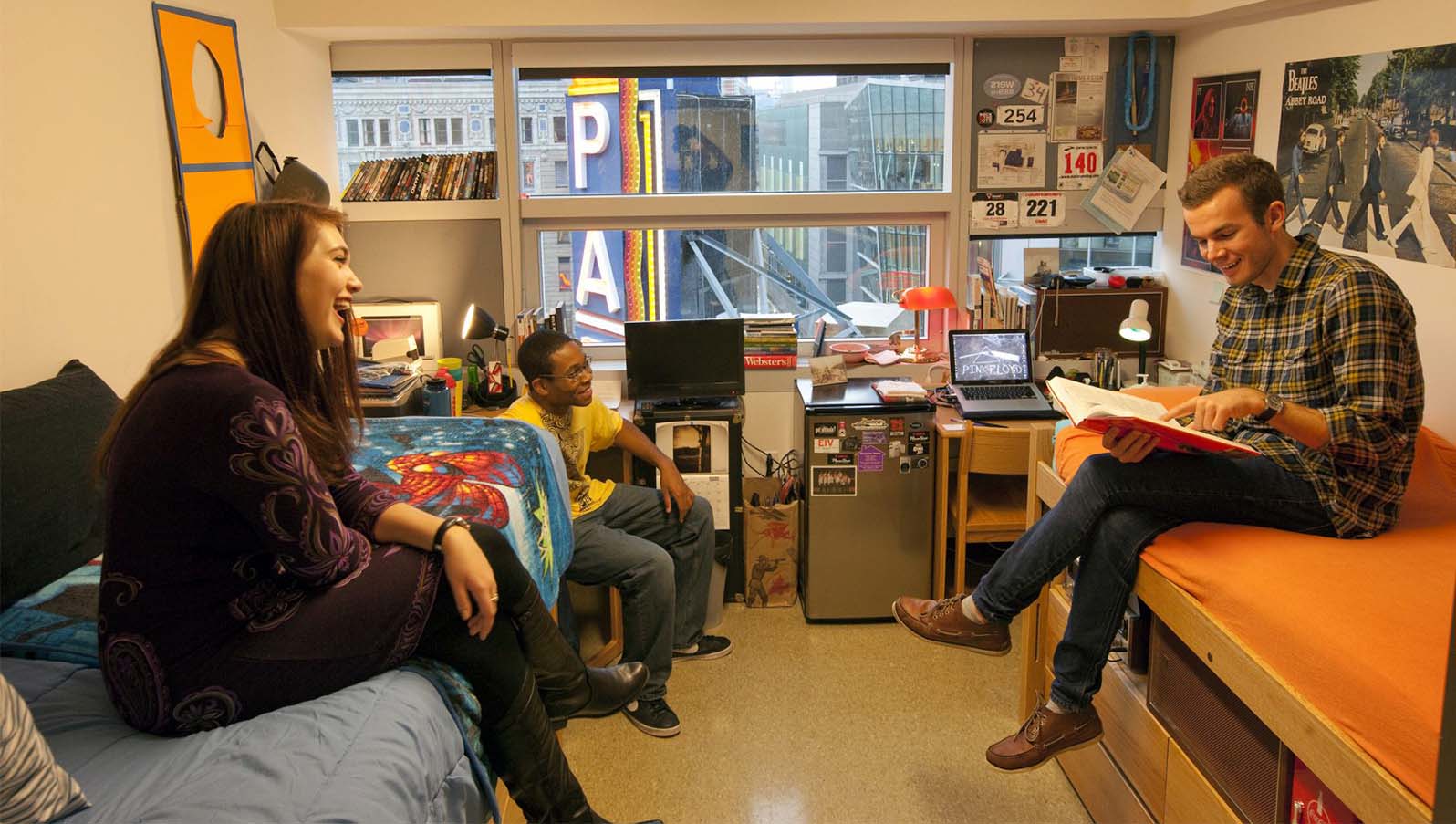 Paramount Center Emerson Dorm rooms with three students socializing