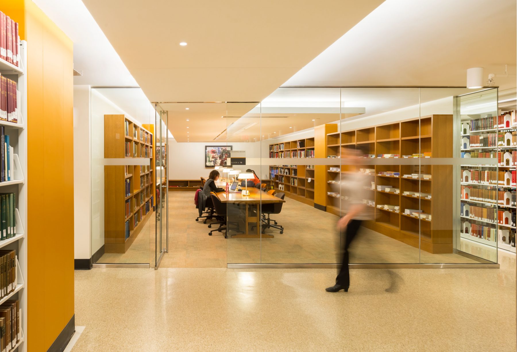 Princeton Firestone Library Interior, a room with a desk is separated by a glass wall