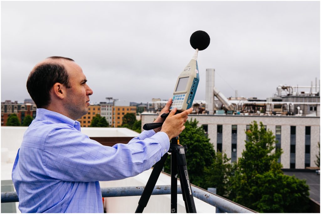 New England Conservatory Exterior, Marc Newmark performs site measurements with acoustic measuring device.