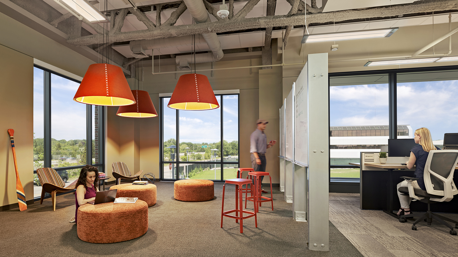 Trip Advisor lounge room with white boards and comfy seating.