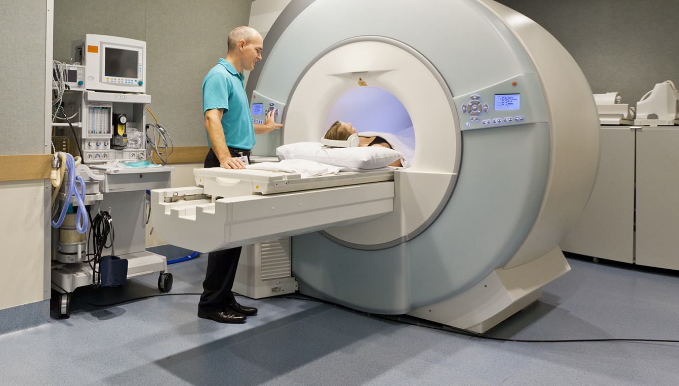 Mri Technician And Patient