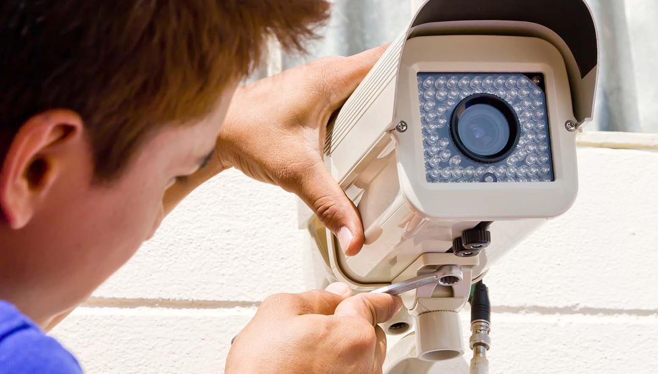 Man Installing Security Camera