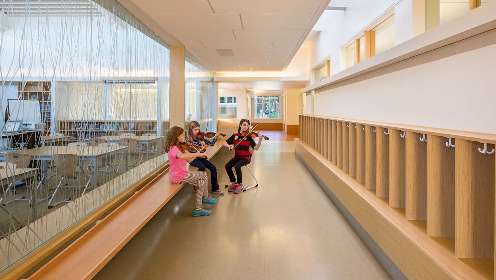 The Field School Hallway, students practice violin