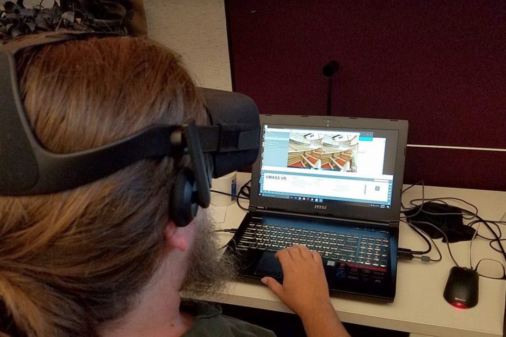 Matt Azevedo using a VR headset to conduct a 3DListening auralization.