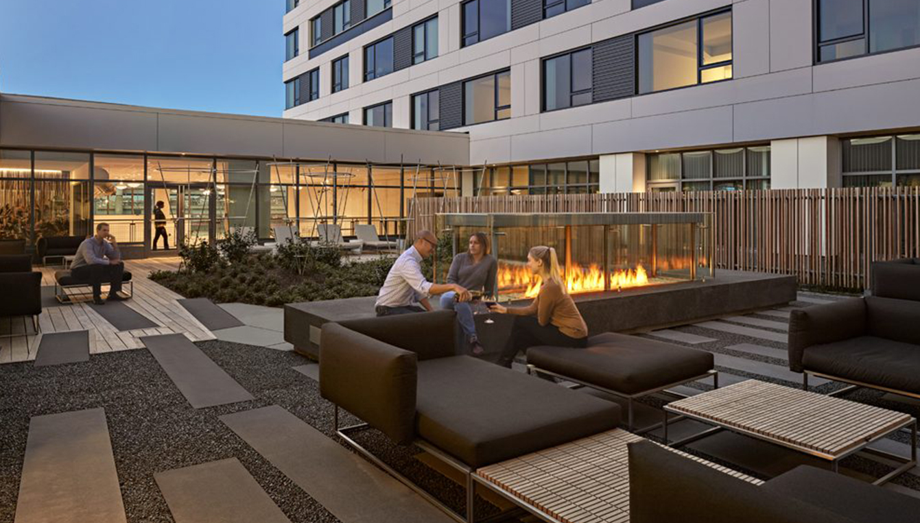 People Enjoying Wine On Patio