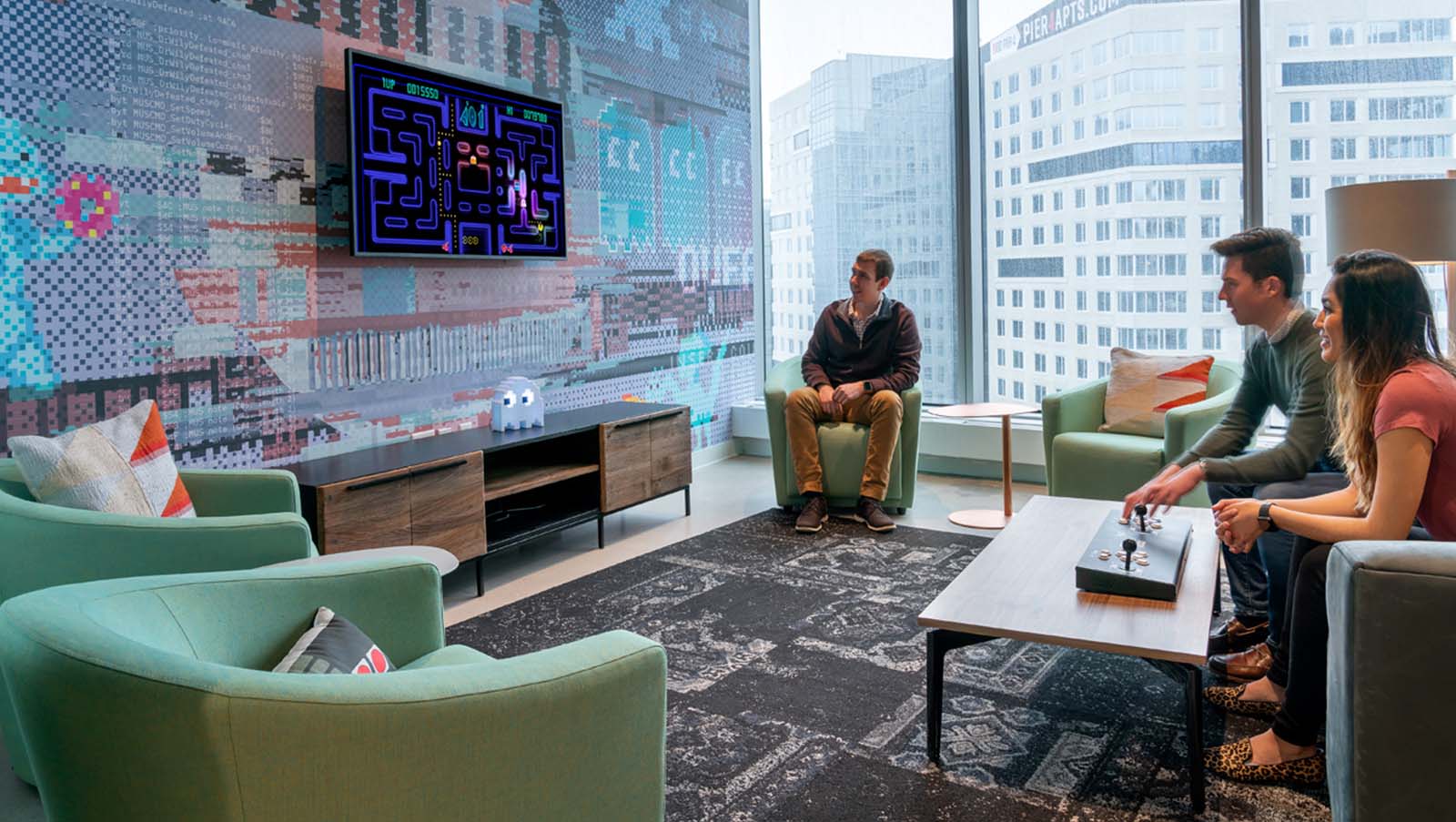 Ptc Boston Hq game lounge, pacman is being played on the tv