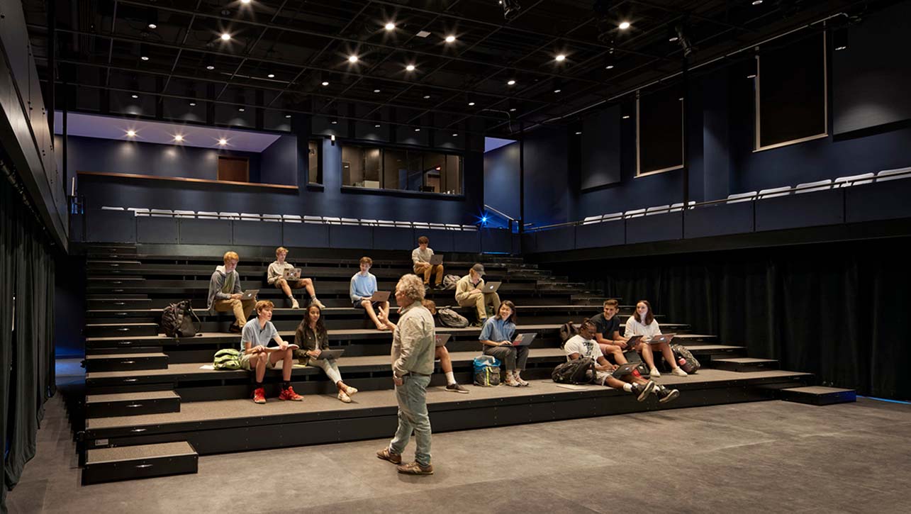 Middlesex School Bass Arts Pavilion and Danoff Center for the Visual Arts, black box theater with seating extended, a professor lectures some student