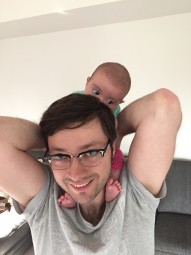 Bill Yoder with his baby on his shoulders