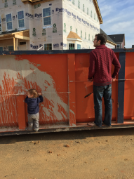 Bill Yoder standing on container with Son