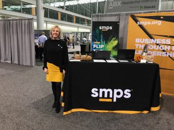 Kate Brannelly manning an SMPS booth at ABX