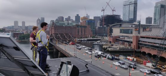 Tyler Tracy and Jack Briskie on roof overlooking TD Garden