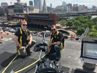 Tyler Tracy and Nick Dragoni taking sound measurements, zakim bridge and TD garden in background