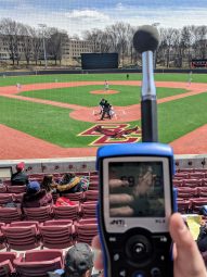 Ken Bourinot performing site measurements at BC softball field