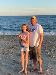 Ken Bourinot with daughter at the beach