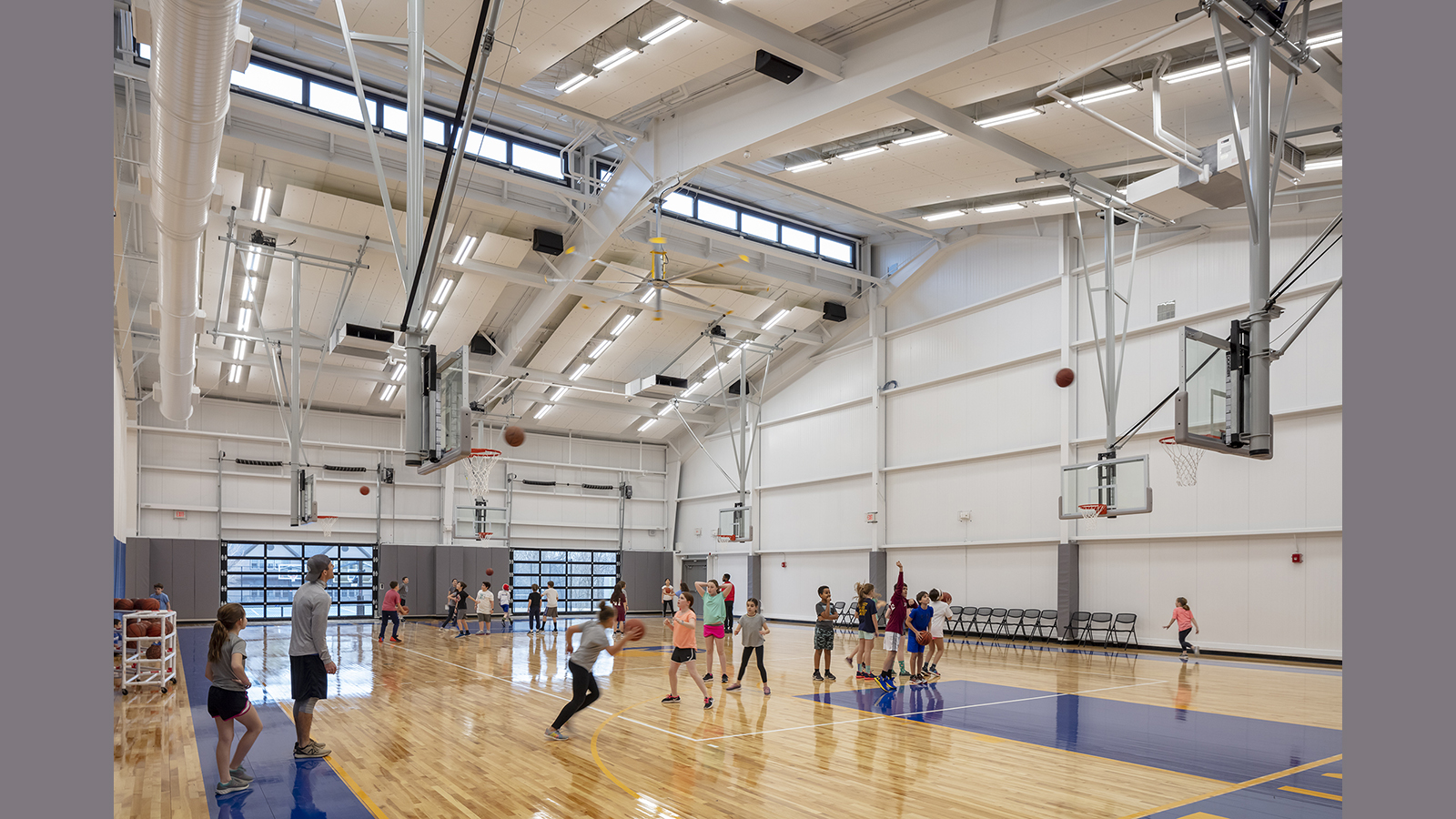 Belmont Day School Gym, students play basketball