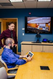 Brian and Corey Working in a conference room