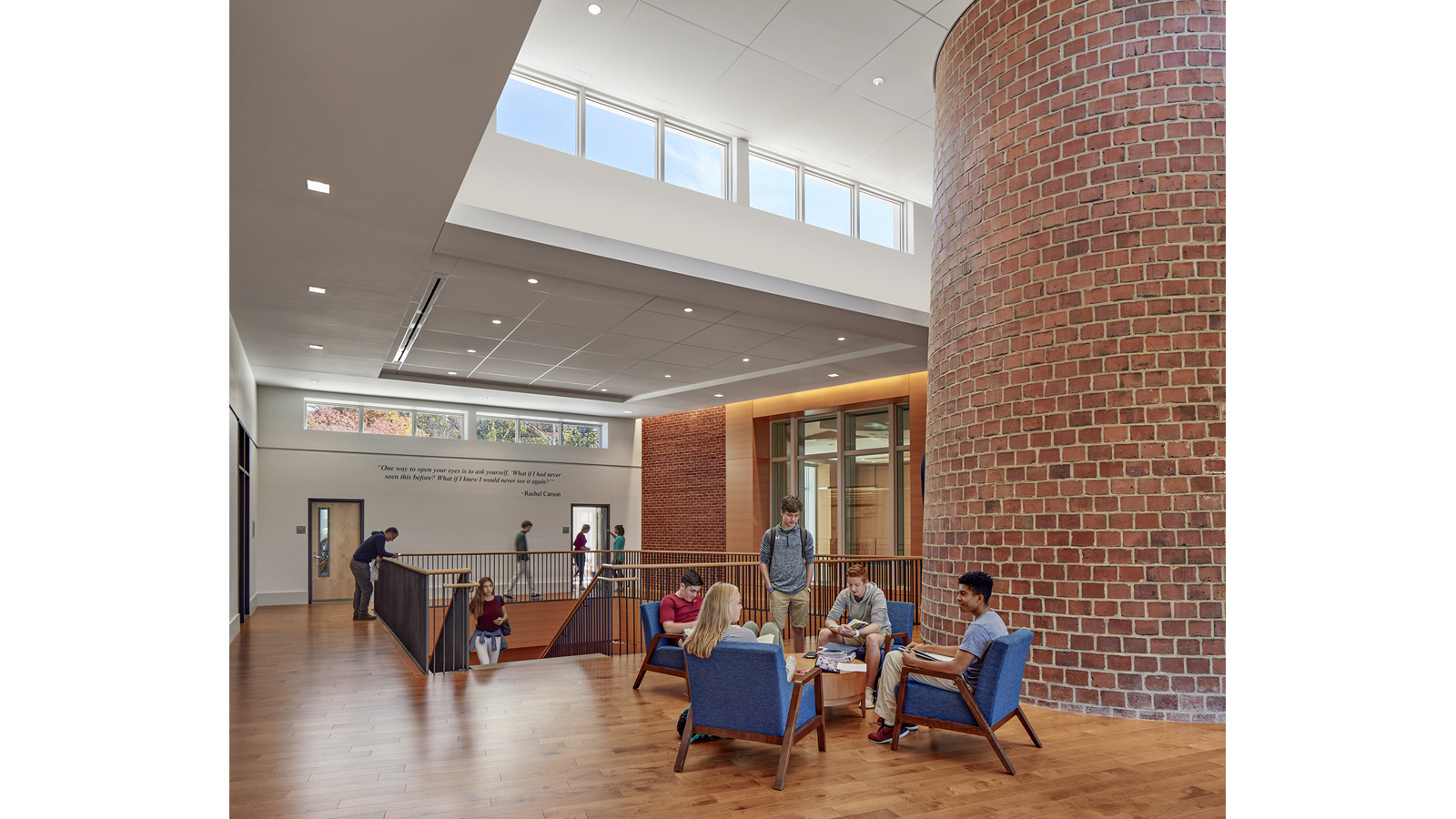 Middlesex Rachel Carson Music and Campus Center, students sit around the old brick chimney