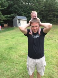 Ethan with his baby on his shoulders