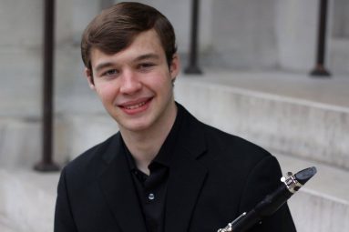 Alex Roehl holding Clarinet