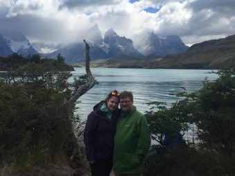 Liz Outside in front of a lake with a mountain in the background