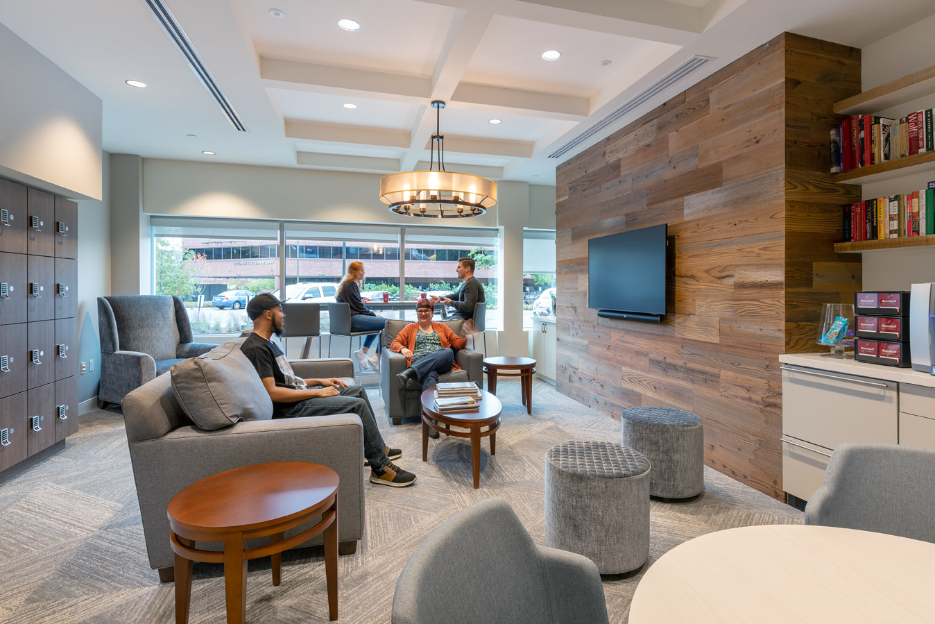 Home Base Clinic lounge area with TV and shelves