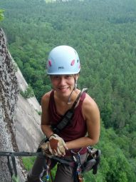 Rose Mary Su climbing photo, with forest in background