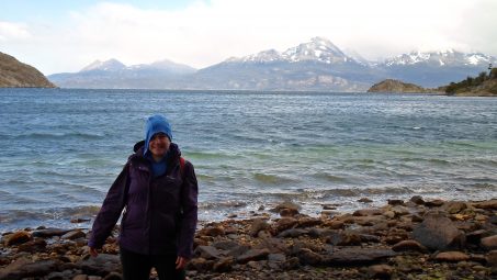 Liz Lamour Croteau in front of a lake with mountains in the background