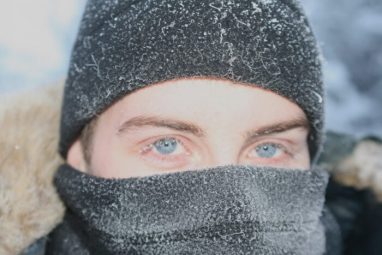 Josh Brophy in Alaska with snow on his mask and beanie