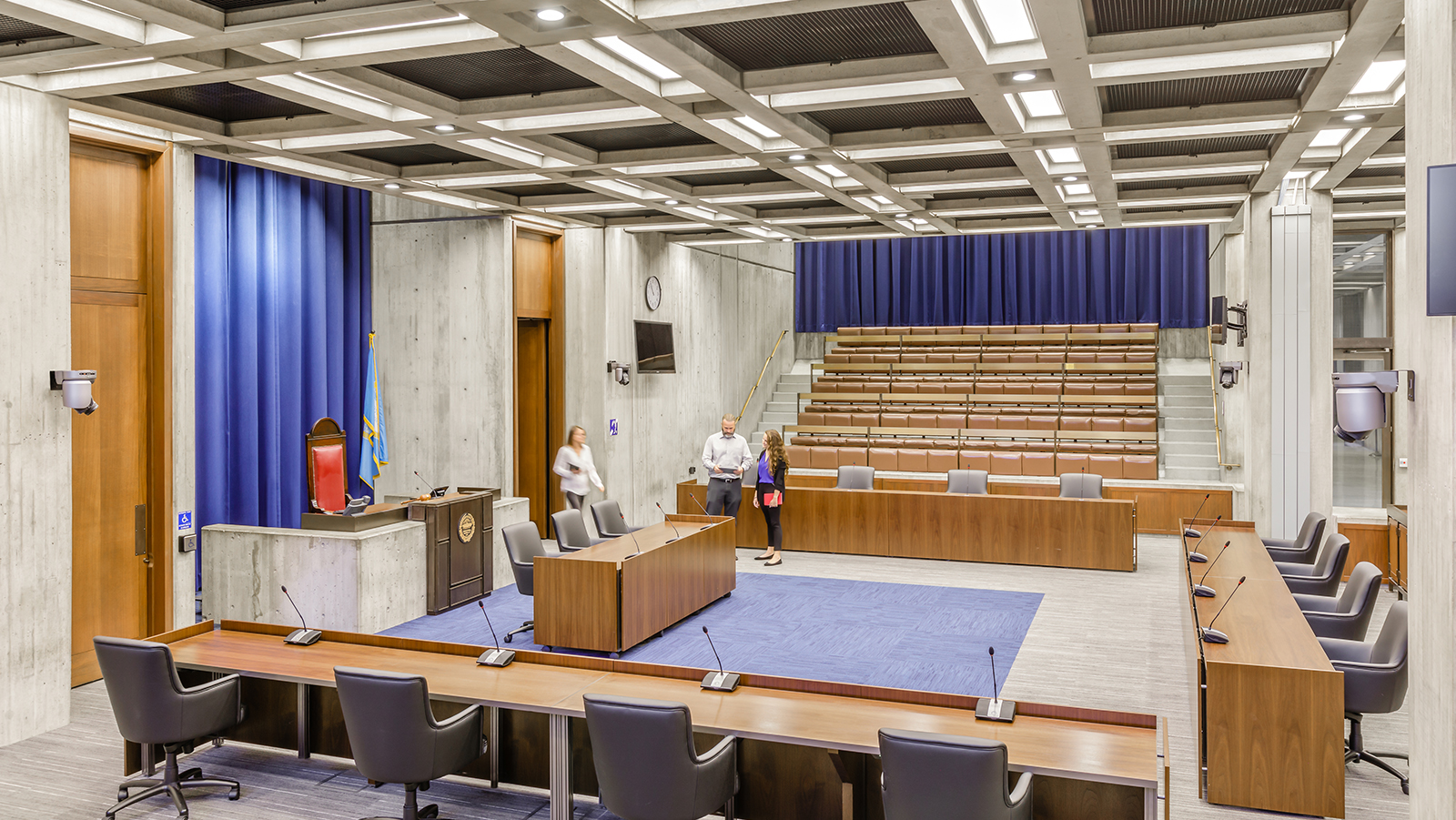 Boston City Hall Council Chamber, three people enter the room