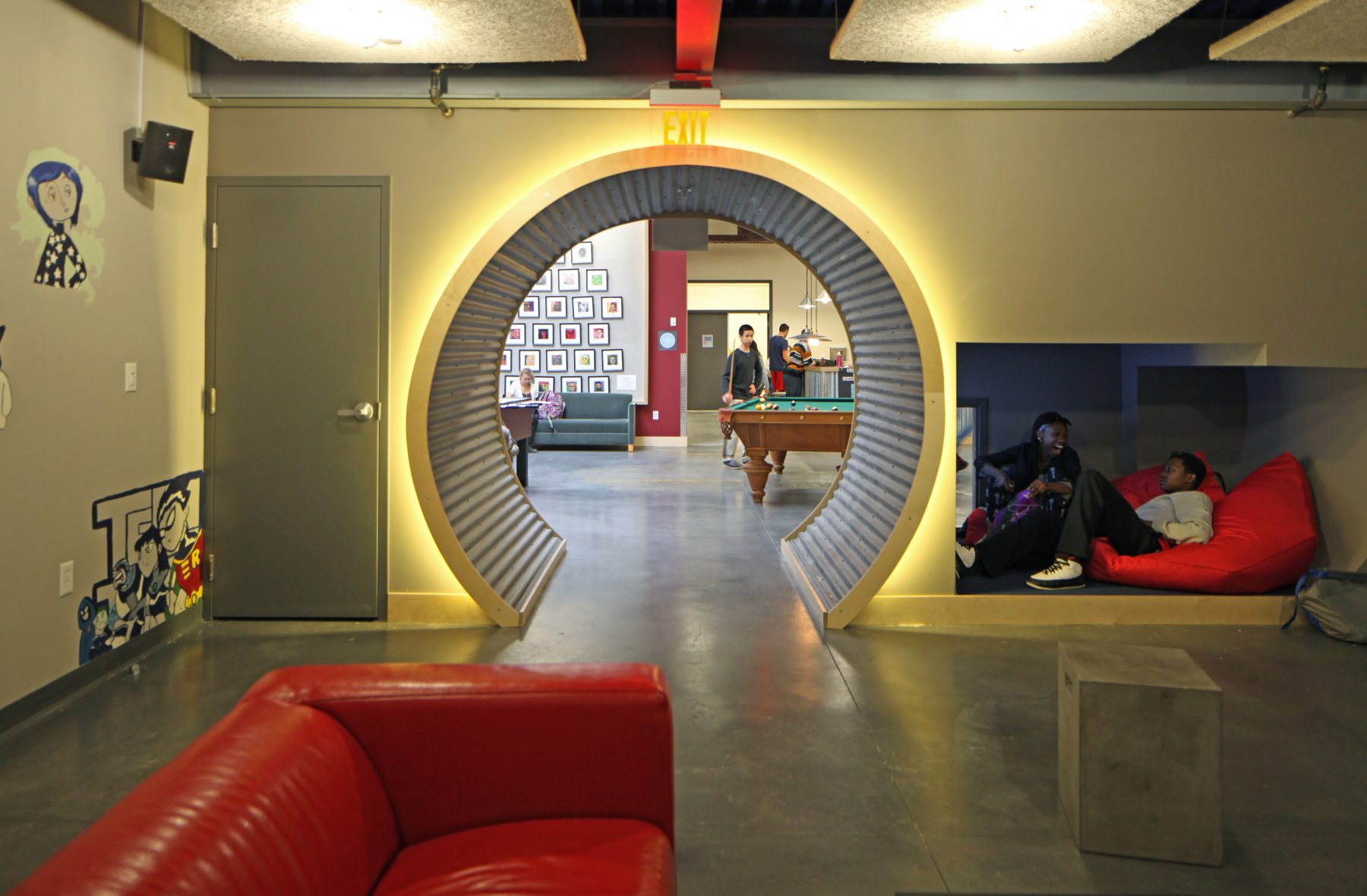 Brookline Teen Center Interior with lounge areas and circular arch way