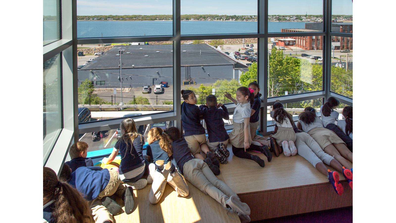 Irwin Jacobs Elementary School Interior, children look out of a window looking at the river
