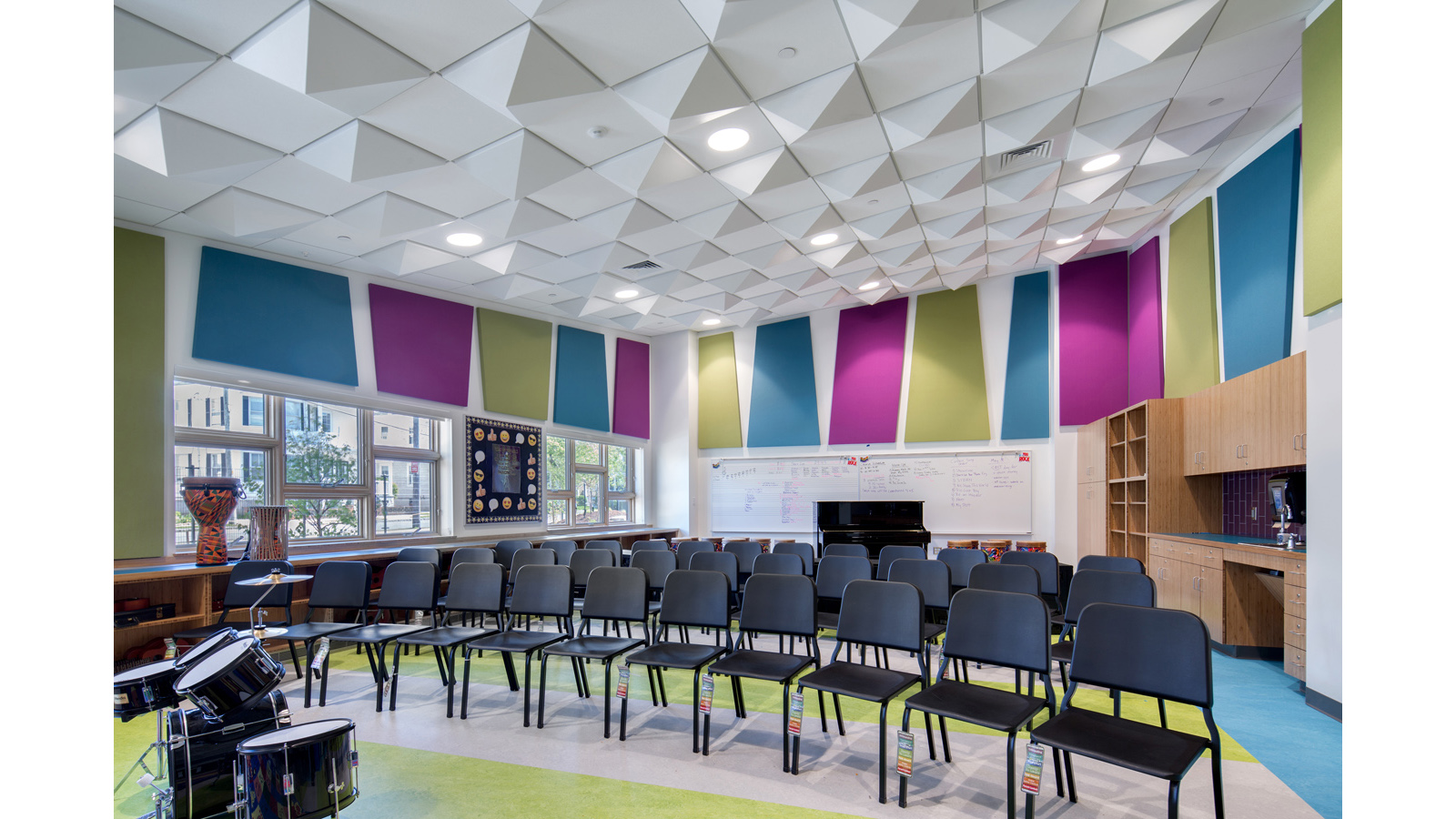 Irwin Jacobs Elementary School Interior, music classroom with drums, piano and other instruments.