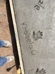 A photo of Khaleela's handprint in concrete