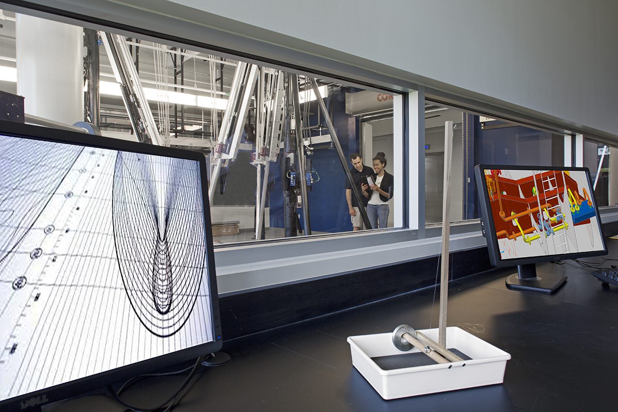 Old Dominion Research Building Lab, two computers show computer models of the experiments