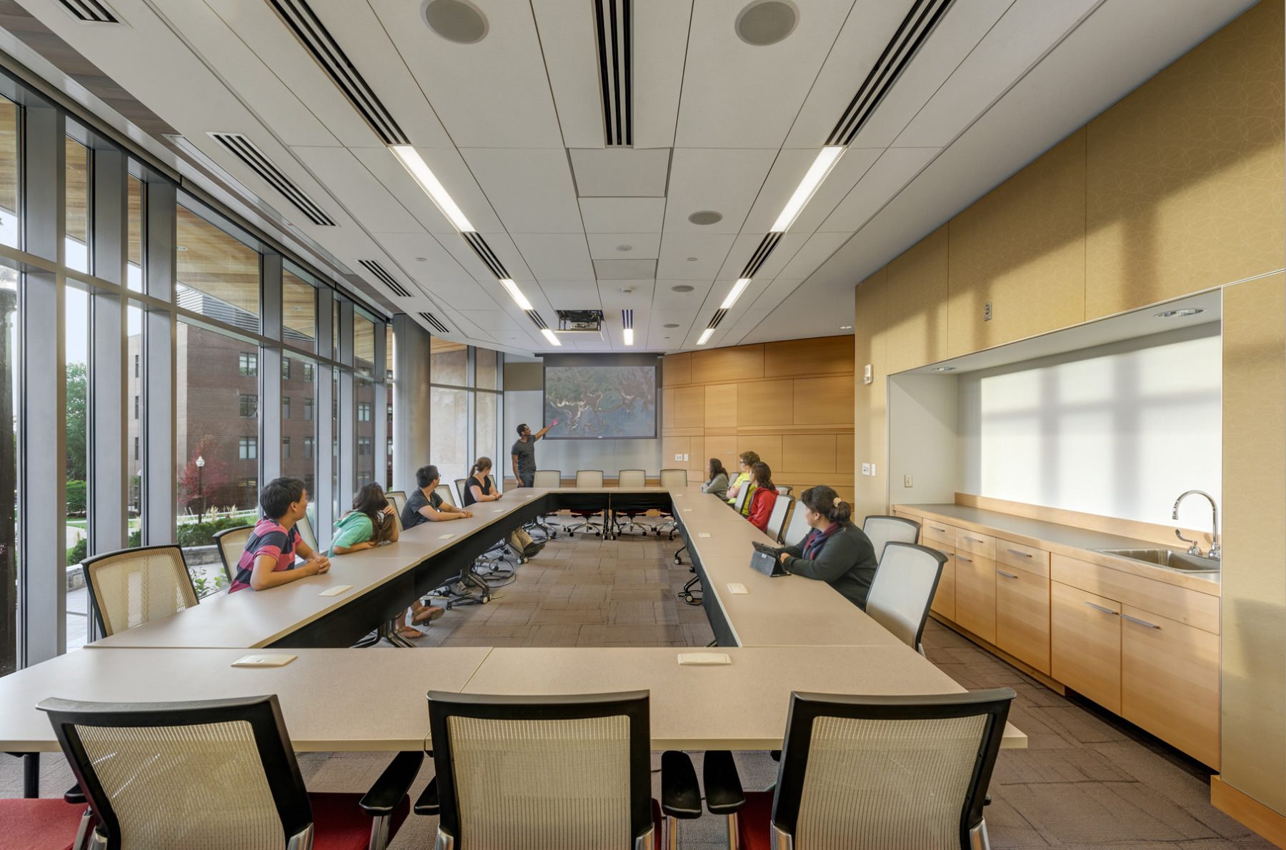 UMASS Life Science Lab Conference Room, a student presents to 8 others