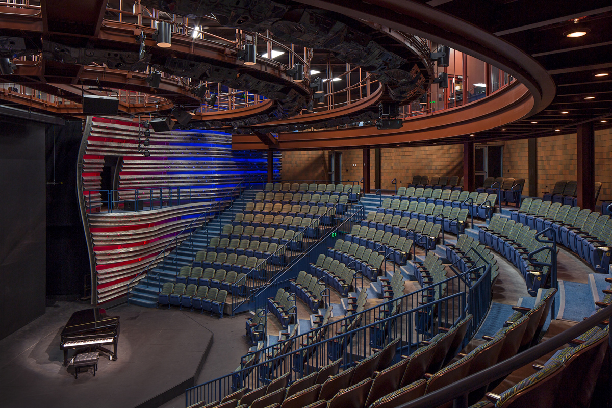 University Southern Indiana Teaching Theater Interior, empty seats with a piano on the stage.