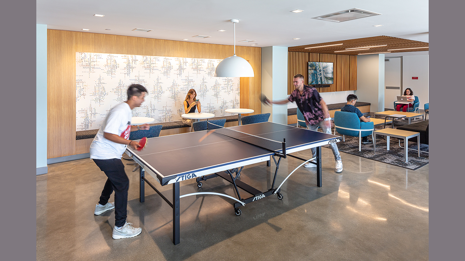 Loyola Marymount University Student Housing in Los Angeles, students play ping pong