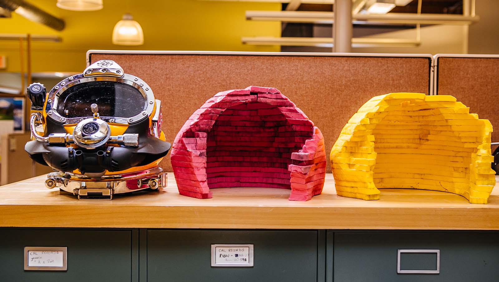 The diving helmet on the table next to sound absorptive test material